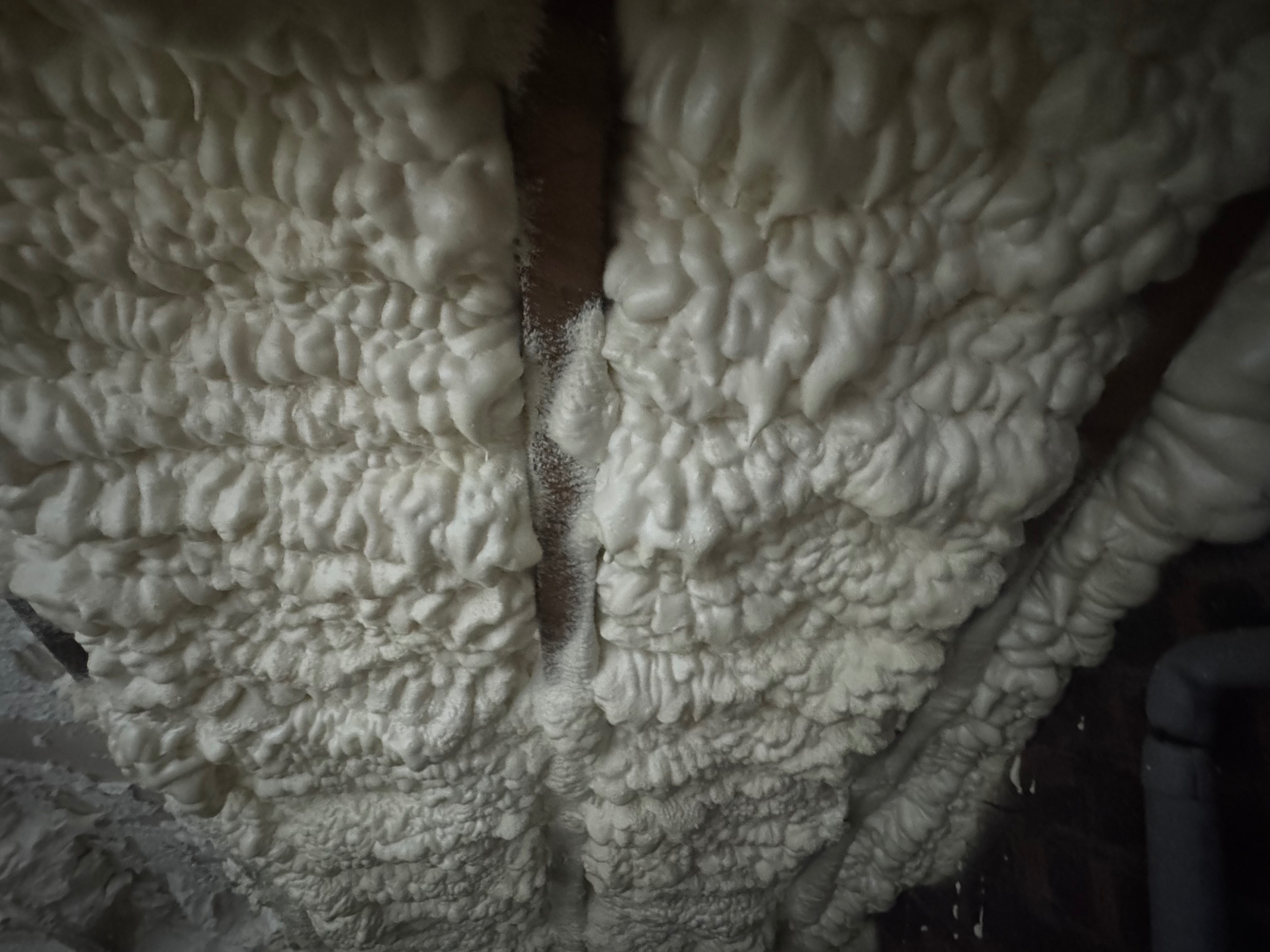 Spray foam between roof rafters before removal